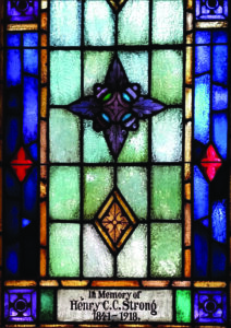 blue stained glass window with start design